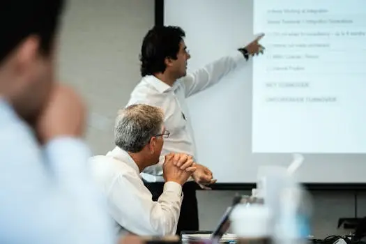 Professional setting with team members focused on a business presentation. Ideal for corporate themes.